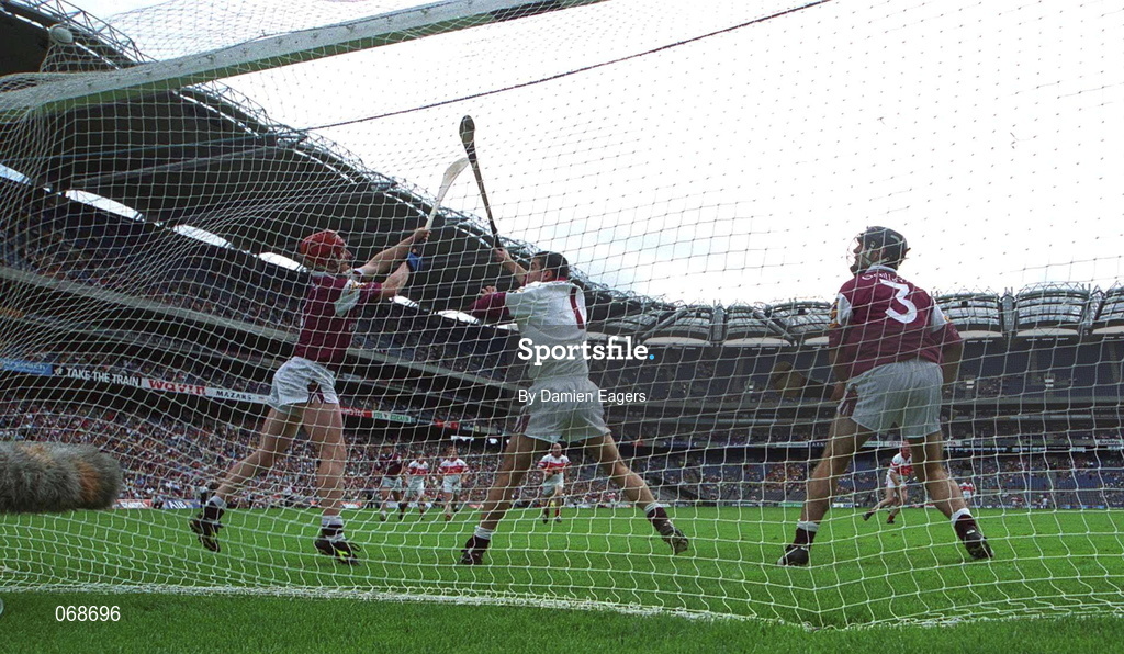29 July 2001; Galway players from left, Ollie Canning, Michael Crimmons and Michael Healy fail to stop a penalty by Eugene Cloonan of Derry during the Guinness All-Ireland Senior hurling Championship Quarter-Final match between Galway and Derry at Croke Park in Dublin. Photo by Damien Eagers/Sportsfile