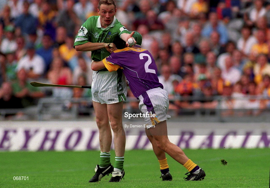 29 July 2001; Owen O'Neill of Limerick in action against Rory Mallon of Wexford during the Guinness All-Ireland Senior Hurling Championship Quarter-Final match between Wexford and Limerick at Croke Park in Dublin. Photo by Damien Eagers/Sportsfile