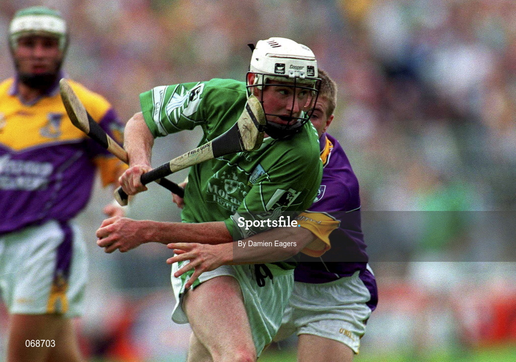 29 July 2001; Paul O'Grady of LImerick is tackled by Trevor Kelly of Wexford during the Guinness All-Ireland Senior Hurling Championship Quarter-Final match between Wexford and Limerick at Croke Park in Dublin. Photo by Damien Eagers/Sportsfile
