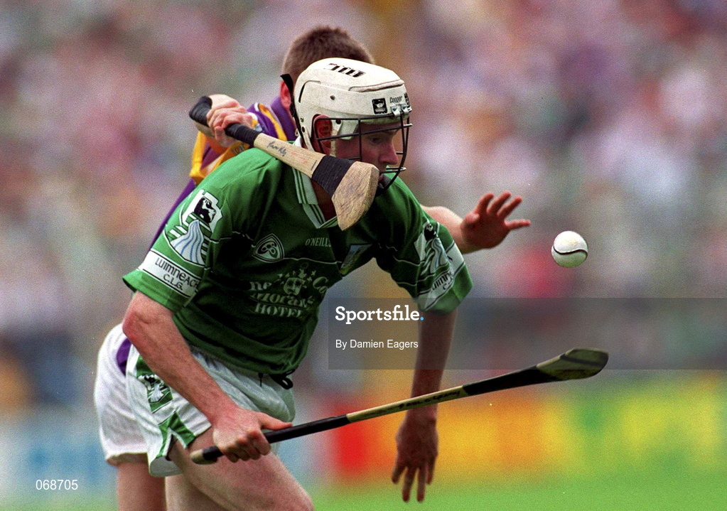 29 July 2001; Paul O'Grady of LImerick is tackled by Trevor Kelly of Wexford during the Guinness All-Ireland Senior Hurling Championship Quarter-Final match between Wexford and Limerick at Croke Park in Dublin. Photo by Damien Eagers/Sportsfile