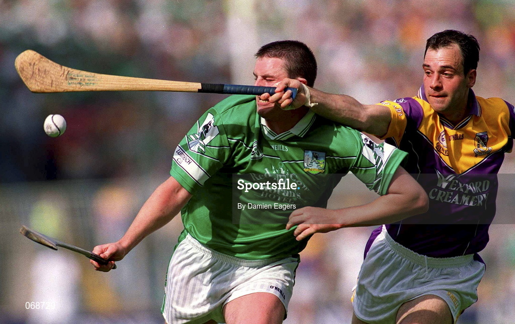 29 July 2001; Brian Begley of Limerick is tackled by Darragh Ryan of Wexford during the Guinness All-Ireland Senior Hurling Championship Quarter-Final match between Wexford and Limerick at Croke Park in Dublin. Photo by Damien Eagers/Sportsfile