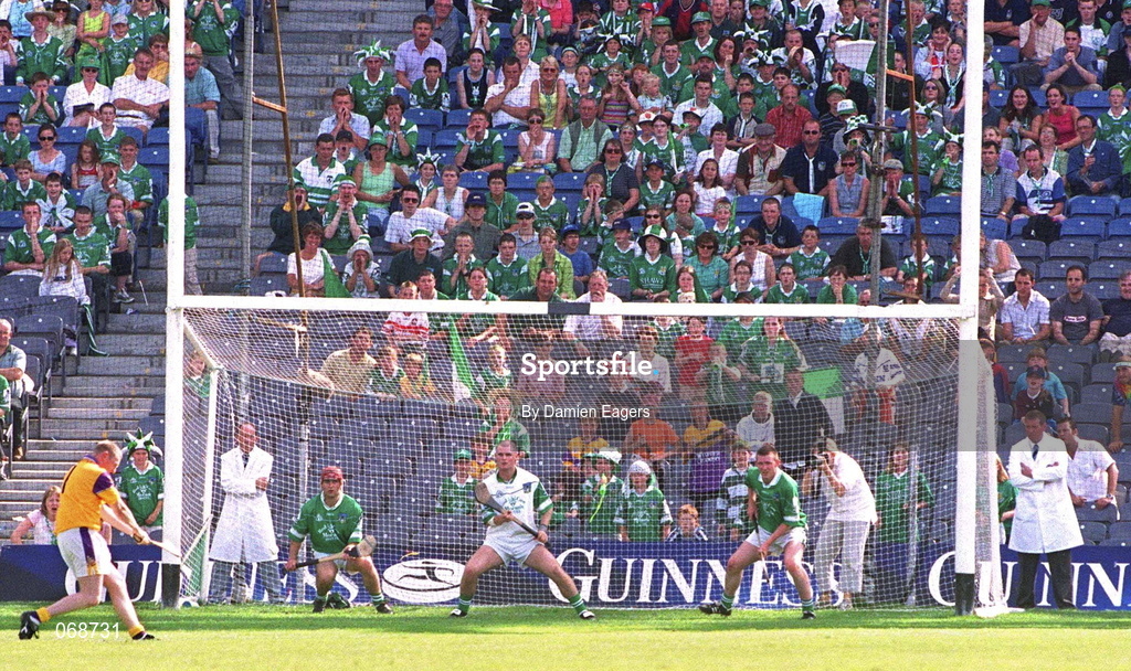 29 July 2001; Wexford goalkeeper Damien Fitzhenry scores his sides second during the Guinness All-Ireland Senior Hurling Championship Quarter-Final match between Wexford and Limerick at Croke Park in Dublin. Photo by Damien Eagers/Sportsfile