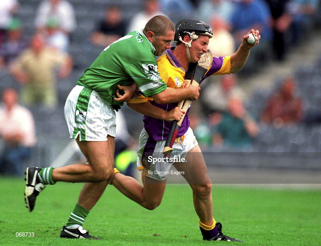 29 July 2001; Rory McCarthy of Wexford is tackled by Clement Smith of Limerick during the Guinness All-Ireland Senior Hurling Championship Quarter-Final match between Wexford and Limerick at Croke Park in Dublin. Photo by Damien Eagers/Sportsfile