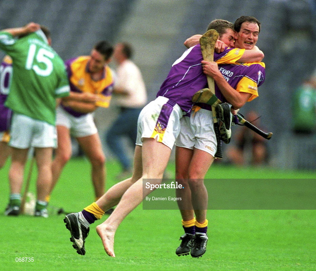 29 July 2001; Wexford players Nicky Lambert, left, and Adrian Fenlon celebrates victory over Limerick following the Guinness All-Ireland Senior Hurling Championship Quarter-Final match between Wexford and Limerick at Croke Park in Dublin. Photo by Damien Eagers/Sportsfile