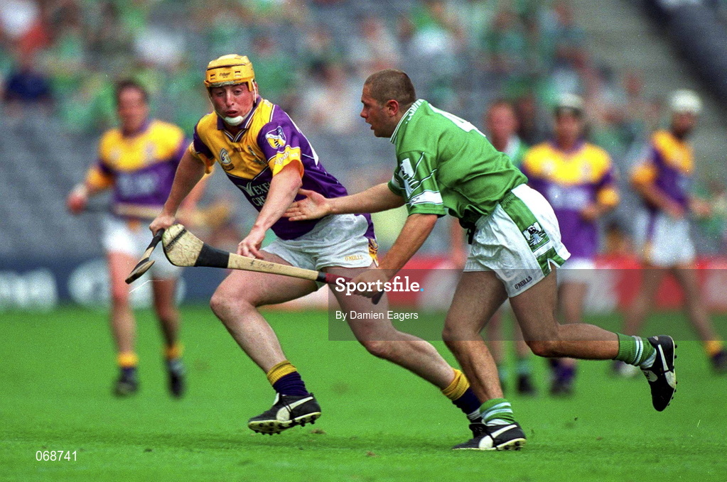 29 July 2001; Garry Laffan of Wexford in action against Clement Smith of Limerick during the Guinness All-Ireland Senior Hurling Championship Quarter-Final match between Wexford and Limerick at Croke Park in Dublin. Photo by Damien Eagers/Sportsfile