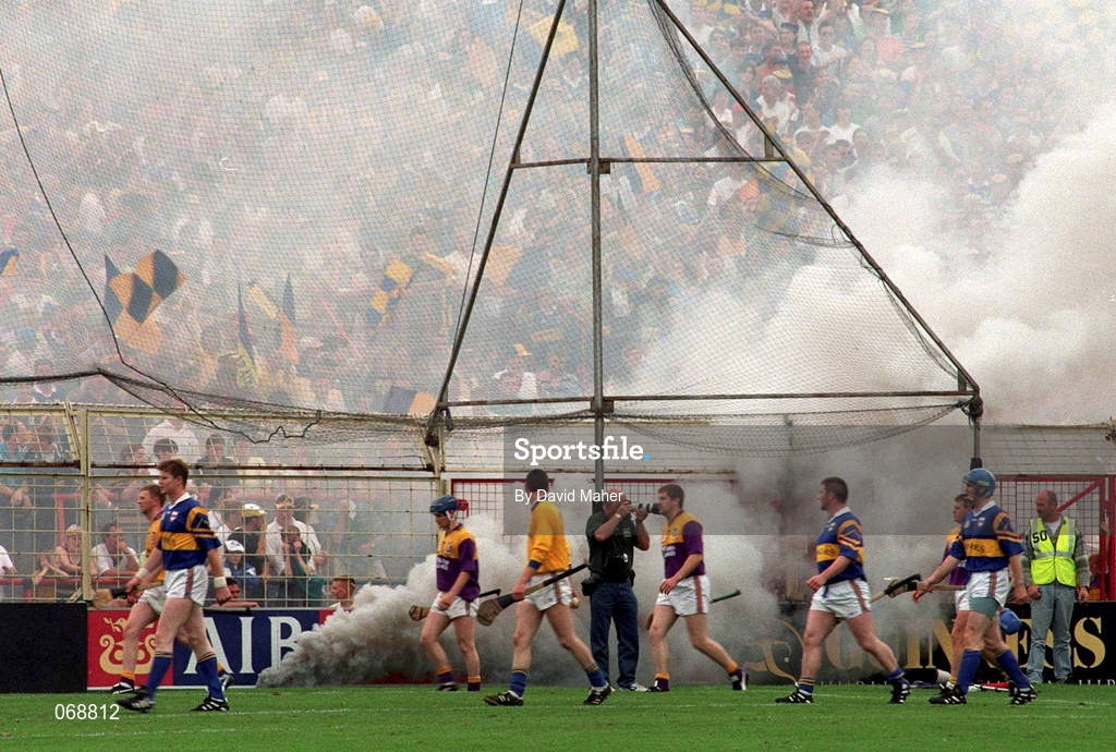 17 August 1997; The Wexford and Tipperary teams parade in front of Hill 16 during the Guinness All-Ireland Senior Hurling Championship Semi-Final match between Tipperary and Wexford at Croke Park in Dublin. Photo by David Maher/Sportsfile