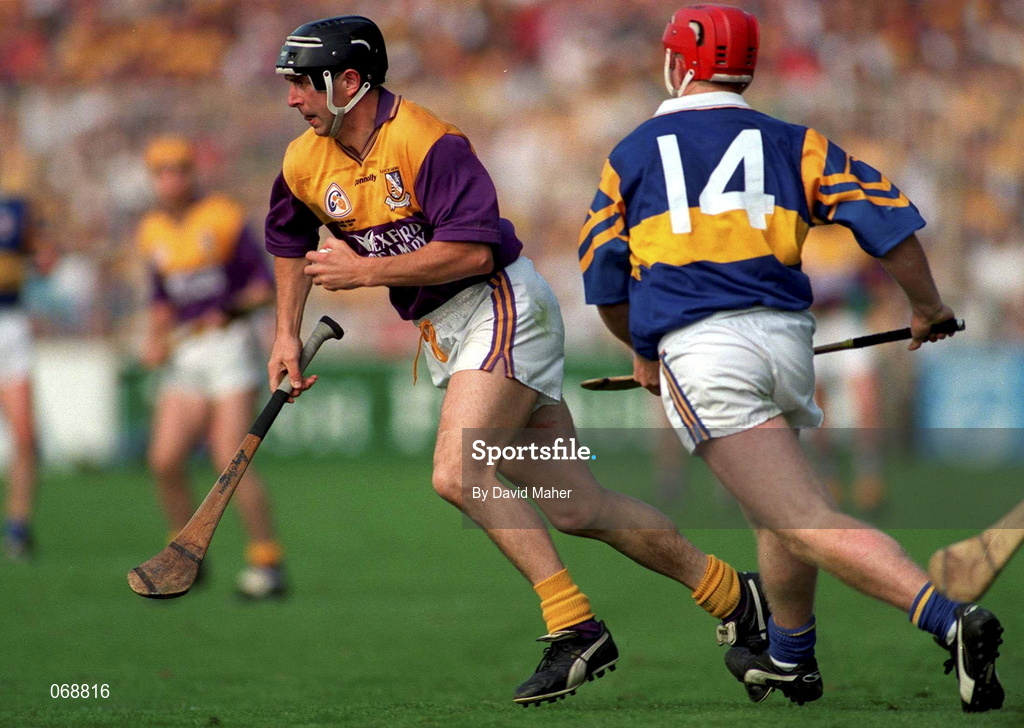 17 August 1997; Larry O'Gorman of Wexford in action against Eugene O'Neill of Tipperary during the Guinness All-Ireland Senior Hurling Championship Semi-Final match between Tipperary and Wexford at Croke Park in Dublin. Photo by David Maher/Sportsfile