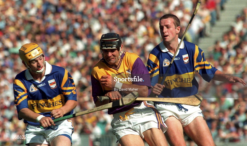 17 August 1997;  John O'Connor of Wexford in action against Liam Cahill, left, and Brian O'Meara of Tipperary during the Guinness All-Ireland Senior Hurling Championship Semi-Final match between Tipperary and Wexford at Croke Park in Dublin. Photo by David Maher/Sportsfile