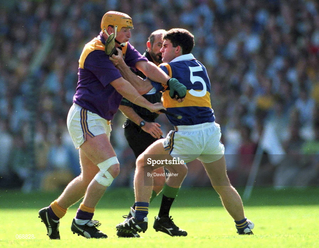 17 August 1997; Garry Laffan of Wexford is tackled by  Ray McManus of Tippperary during the Guinness All-Ireland Senior Hurling Championship Semi-Final match between Tipperary and Wexford at Croke Park in Dublin. Photo by David Maher/Sportsfile