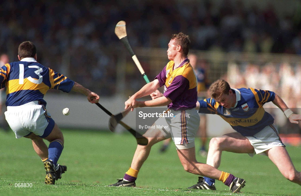 17 August 1997; Larry Murphy of Wexford is hooked by Michael Cleary, left, and Aidan Ryan of Tipperary during the Guinness All-Ireland Senior Hurling Championship Semi-Final match between Tipperary and Wexford at Croke Park in Dublin. Photo by David Maher/Sportsfile