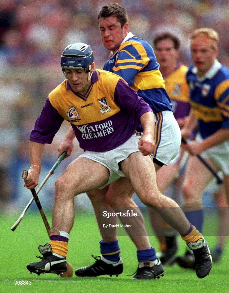17 August 1997; Liam Dunne of Wexford in action against Liam McGrath of Tipperary during the Guinness All-Ireland Senior Hurling Championship Semi-Final match between Tipperary and Wexford at Croke Park in Dublin. Photo by David Maher/Sportsfile