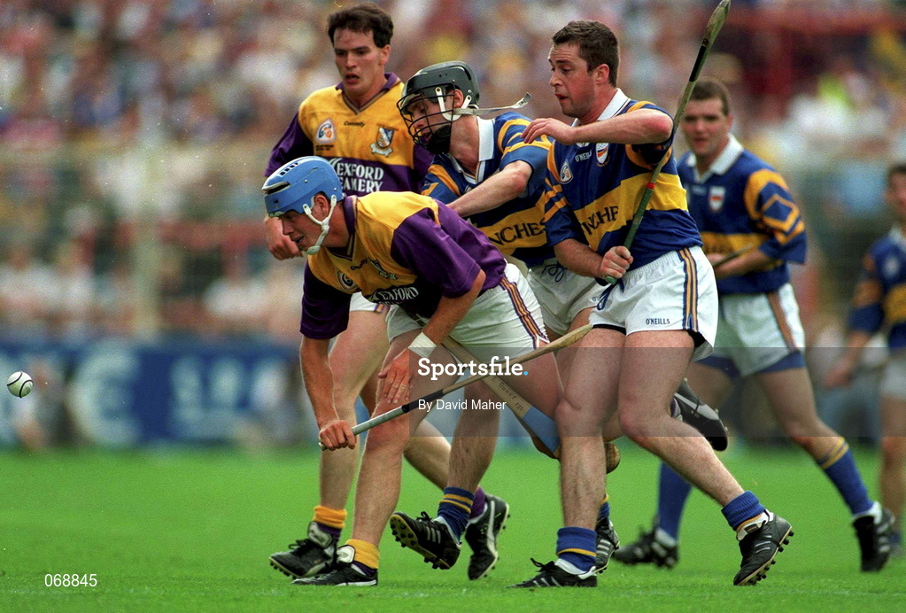 17 August 1997; Eugene Furlong of Wexford in action against Liam McGrath of Tipperary during the Guinness All-Ireland Senior Hurling Championship Semi-Final match between Tipperary and Wexford at Croke Park in Dublin. Photo by David Maher/Sportsfile