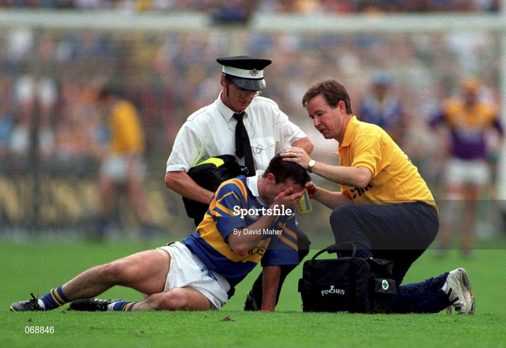 17 August 1997; Thomas Dunne of Tipperary is attended to after receiving an injury during the Guinness All-Ireland Senior Hurling Championship Semi-Final match between Tipperary and Wexford at Croke Park in Dublin. Photo by David Maher/Sportsfile