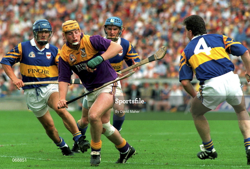 17 August 1997; Garry Laffan of Wexford in action against Michael Ryan, right, Colm Bonnar, left, and Noel Sheehy of Tipperary during the Guinness All-Ireland Senior Hurling Championship Semi-Final match between Tipperary and Wexford at Croke Park in Dublin. Photo by David Maher/Sportsfile