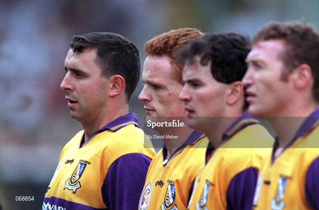 17 August 1997; Larry O'Gorman of Wexford, left, stands for the official team photograph during the Guinness All-Ireland Senior Hurling Championship Semi-Final match between Tipperary and Wexford at Croke Park in Dublin. Photo by David Maher/Sportsfile