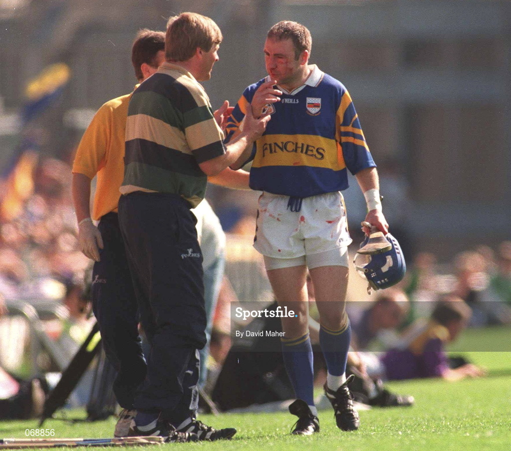 17 August 1997; John Leahy of Tipperary leaves the fild with a blood injury during the Guinness All-Ireland Senior Hurling Championship Semi-Final match between Tipperary and Wexford at Croke Park in Dublin. Photo by David Maher/Sportsfile