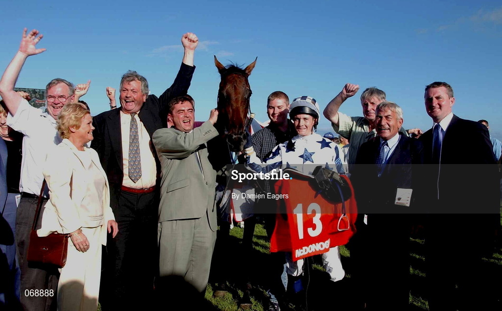 31 July 2001; Jockey Colm O'Donoghue celebrates with members of the Halfway House Syndicate after winning the McDonagh European Breeders Fund Handicap on Sheer Tenby during day 2 of the Galway Summer Racing Festival at Ballybrit Racecourse in Galway. Photo by Damien Eagers/Sportsfile