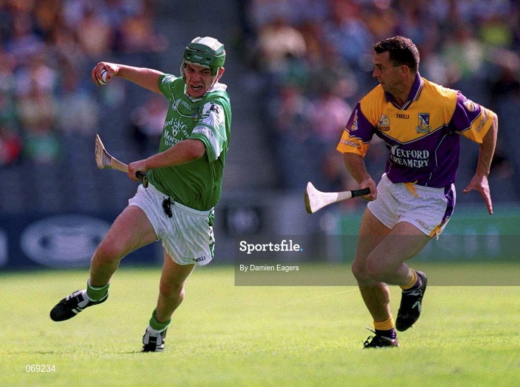 29 July 2001; Mike O'Brien of Limerick in action against Larry O'Gorman of Wexford during the Guinness All-Ireland Senior Hurling Championship Quarter-Final match between Wexford and Limerick at Croke Park in Dublin. Photo by Damien Eagers/Sportsfile