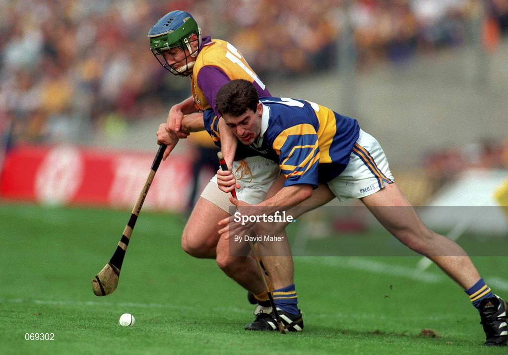 17 August 1997; Larry Murphy of Wexford in action against Liam Sheedy of Tipperary during the Guinness All-Ireland Senior Hurling Championship Semi-Final match between Tipperary and Wexford at Croke Park in Dublin. Photo by David Maher/Sportsfile