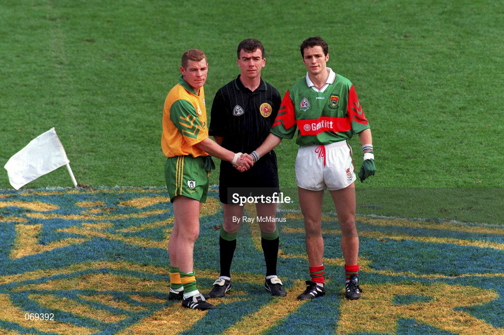 29 September 1996; Meath captain Tommy Dowd and Mayo captain Noel Connelly shake hands in front of referee Pat McEnaney during the All-Ireland Senior Football Championship Final Replay match between Meath and Mayo at Croke Park in Dublin. Photo by Ray McManus/Sportsfile