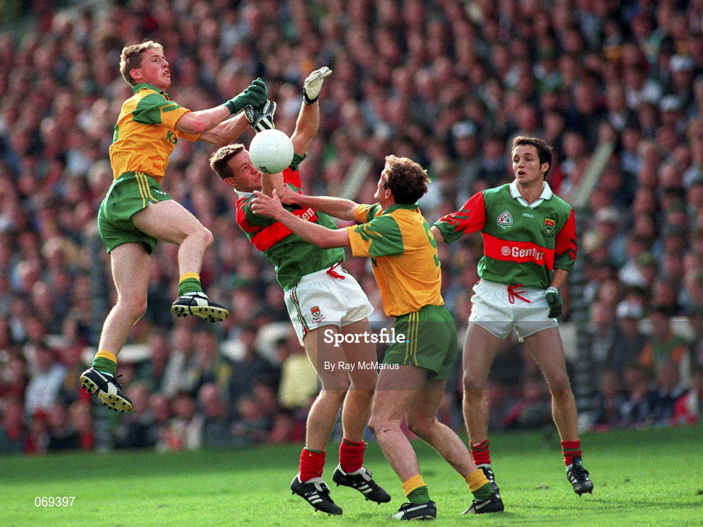 29 September 1996; Trevor Giles of Meath and John McDermot, right, battle for possession against David Brady, left, and Noel Connelly of Mayo during the All-Ireland Senior Football Championship Final Replay match between Meath and Mayo at Croke Park in Dublin. Photo by Ray McManus/Sportsfile