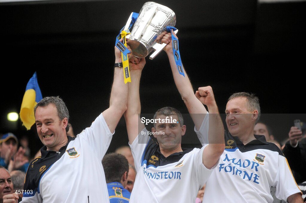 5 September 2010; Tipperary manager Liam Sheedy celebrates with the Liam MacCarthy cup alongside selector Michael Ryan, left, and coach Eamon O'Shea, right. GAA Hurling All-Ireland Senior Championship Final, Kilkenny v Tipperary, Croke Park, Dublin. Photo by Sportsfile