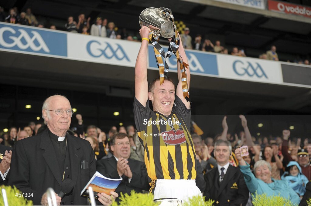 5 September 2010; Kilkenny captain Cillian Buckley lifts the Irish Press Cup aloft after being presented with it by Archbishop Dermot Clifford, Archbishop of Cashel (Emly), Apostolic Administrator of Cloyne. ESB GAA Hurling All-Ireland Minor Championship Final, Kilkenny v Clare, Croke Park, Dublin. Picture credit: Ray McManus / SPORTSFILE