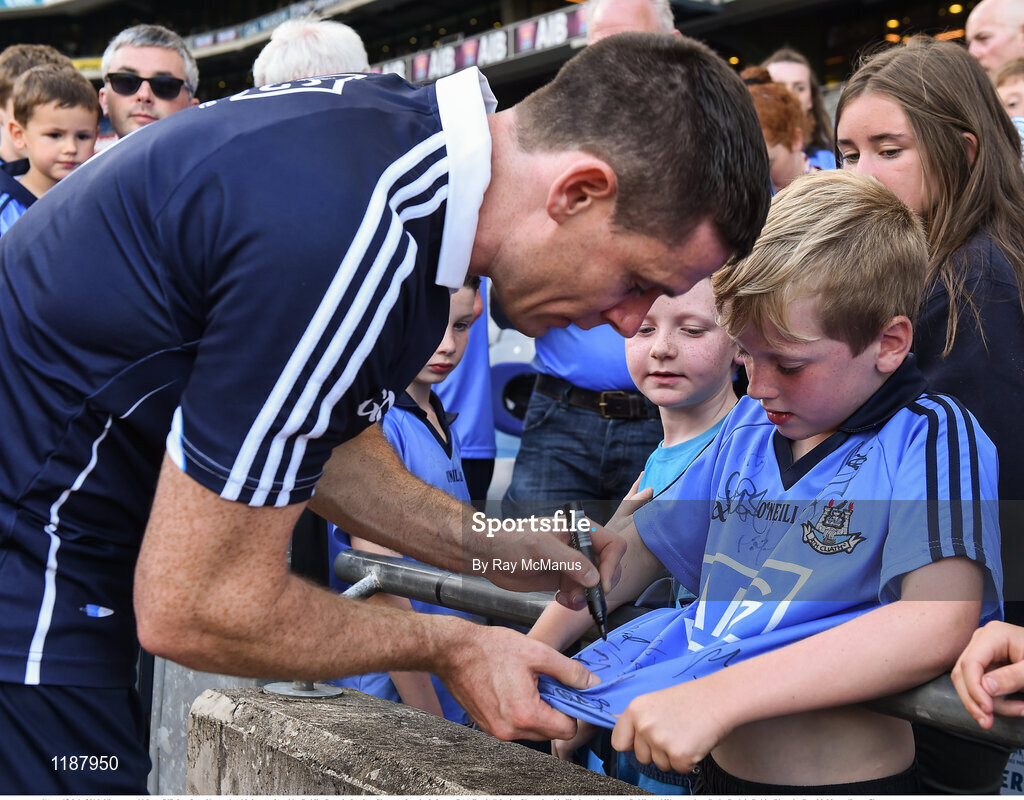 17 July 2016; Nine year old Sean O'Brien, from Navan, has his jersey signed by Dublin Captain Stephen Cluxton after the Leinster GAA Football Senior Championship Final match between Dublin and Westmeath at Croke Park in Dubin. Photo by Ray McManus/Sportsfile