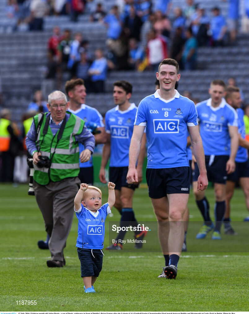 17 July 2016; Eighteen month old Aidan Bastic, a son of Denis, celebrates in front of Dublin's Brian Fenton after the Leinster GAA Football Senior Championship Final match between Dublin and Westmeath at Croke Park in Dubin. Photo by Ray McManus/Sportsfile