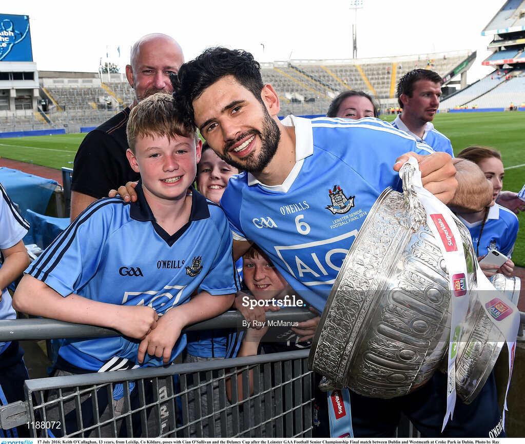 17 July 2016; Keith O'Callaghan, 13 years, from Leixlip, Co Kildare, poses with Cian O'Sullivan and the Delaney Cup after the Leinster GAA Football Senior Championship Final match between Dublin and Westmeath at Croke Park in Dubin. Photo by Ray McManus/Sportsfile
