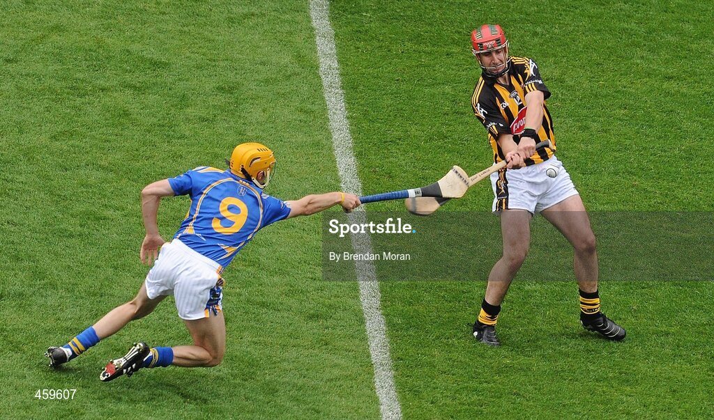5 September 2010; Eoin Larkin, Kilkenny, is hooked by Shane McGrath, Tipperary. GAA Hurling All-Ireland Senior Championship Final, Kilkenny v Tipperary, Croke Park, Dublin. Picture credit: Brendan Moran / SPORTSFILE