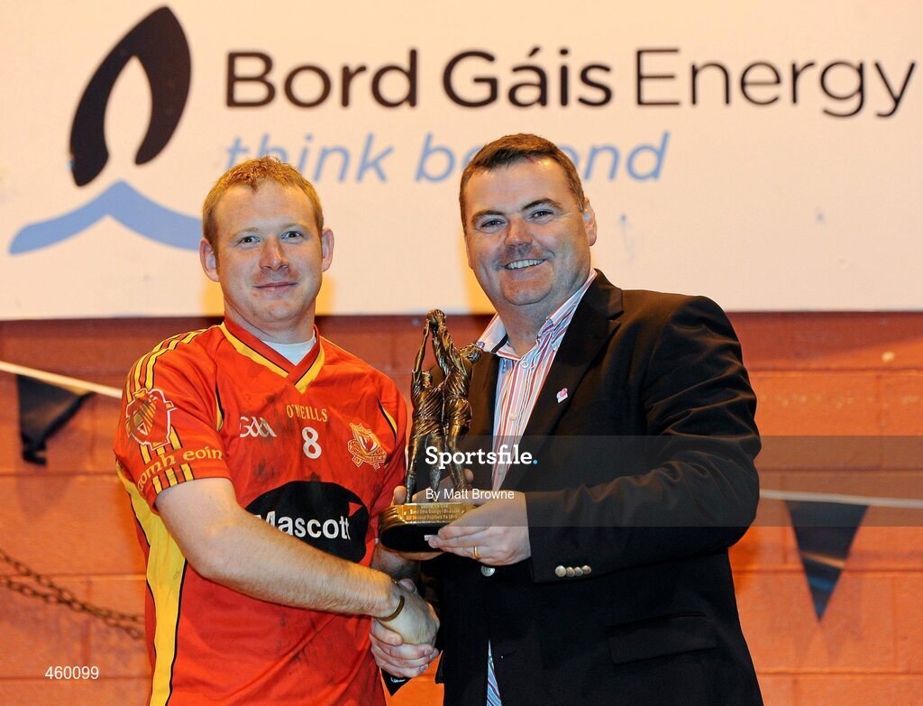 18 September 2010; John Mullins, CEO, Bord Gais Energy presents St. Johns, Drumnaquoile, Co. Down, Damian Murray, with the Bord Gáis Energy / St. Jude’s All-Ireland Junior Football 7s player of the match trophy . 20 teams from around the country travelled to take part in this prestigious competition. Bord Gáis Energy / St. Jude’s All-Ireland Junior Football 7s Tournament, St. Jude's GAA Club, Templeogue, Dublin. Picture credit: Matt Browne / SPORTSFILE