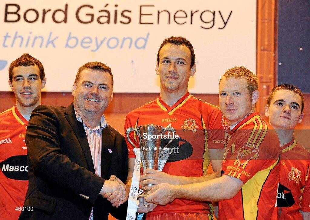 18 September 2010; John Mullins, CEO, Bord Gais Energy presents St. Johns, Drumnaquoile, Co. Down, captain Daniel Marmion, 4, and Damian Murray, 8, with the Bord Gáis Energy / St. Jude’s All-Ireland Junior Football 7s Cup. 20 teams from around the country travelled to take part in this prestigious competition. Bord Gáis Energy / St. Jude’s All-Ireland Junior Football 7s Tournament, St. Jude's GAA Club, Templeogue, Dublin. Picture credit: Matt Browne / SPORTSFILE