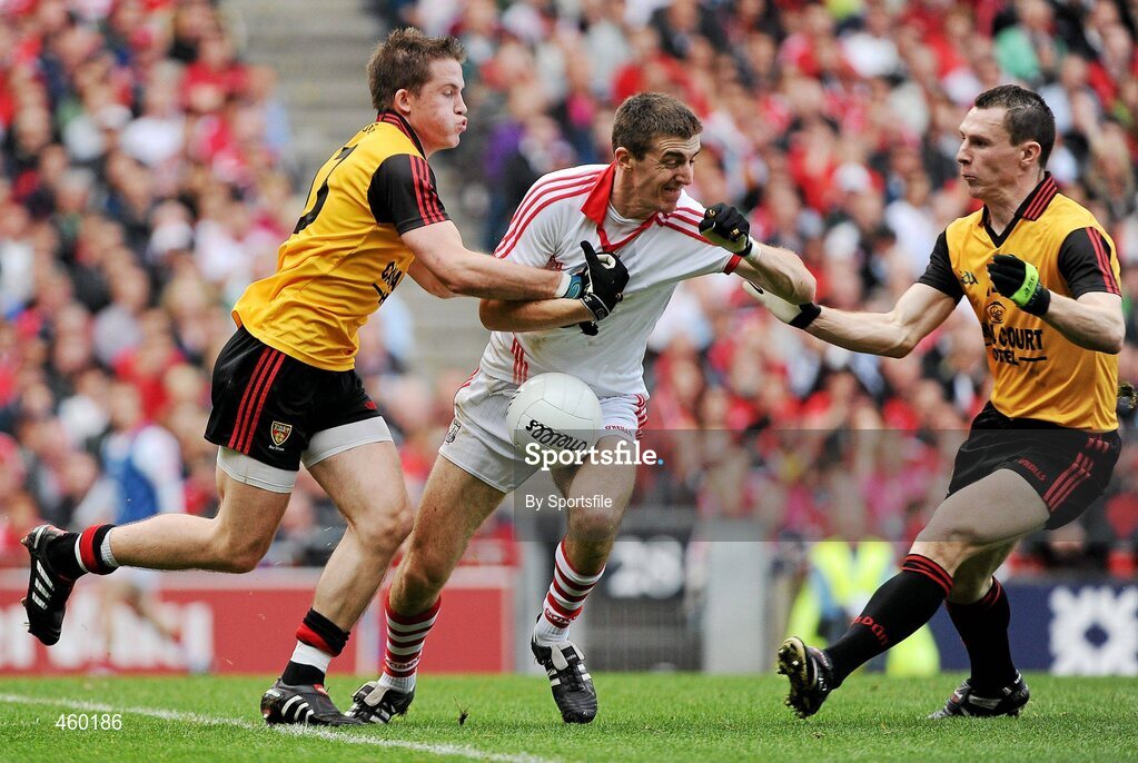 19 September 2010; Ray Carey, Cork, in action against Paul McComiskey, left, and John Clarke, Down. GAA Football All-Ireland Senior Championship Final, Down v Cork, Croke Park, Dublin. Photo by Sportsfile
