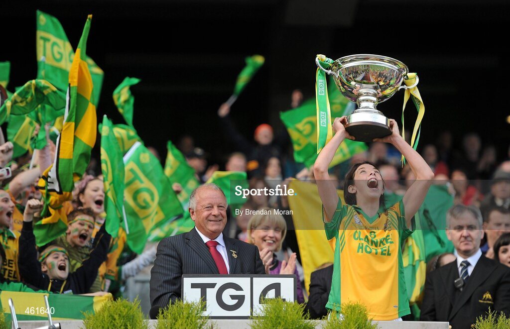 26 September 2010; Donegal captain Aoife McDonnell lifts the cup after the game in the company of Pat Quill, President, Cumann Peil Gael na mBan. TG4 All-Ireland Intermediate Ladies Football Championship Final, Donegal v Waterford, Croke Park, Dublin. Picture credit: Brendan Moran / SPORTSFILE