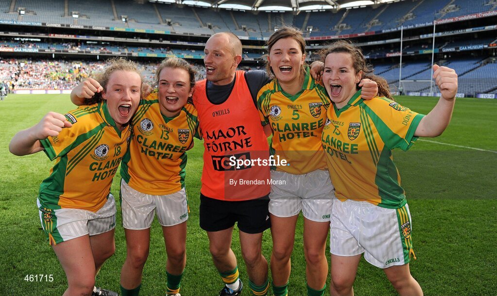 26 September 2010; Donegal players, from left, Kate Keeney, Eilish Ward, Ciara Hegarty and Geraldine McLoughlin celebrate with selector Barney Curran after the game. TG4 All-Ireland Intermediate Ladies Football Championship Final, Donegal v Waterford, Croke Park, Dublin. Picture credit: Brendan Moran / SPORTSFILE