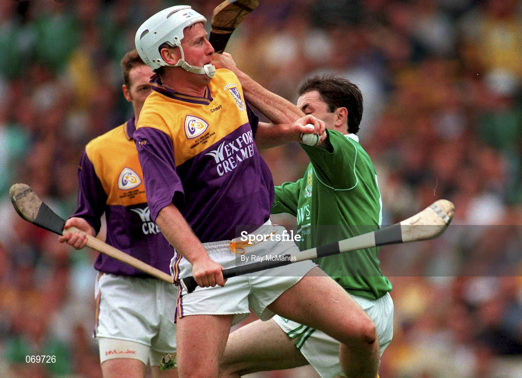 1 September 1996; Tom Dempsey of Wexford in action against Declan Nash of Limerick during the Guinness All-Ireland Senior Hurling Championship Final match between Wexford and Limerick at Croke Park in Dublin. Photo by Ray McManus/Sportsfile