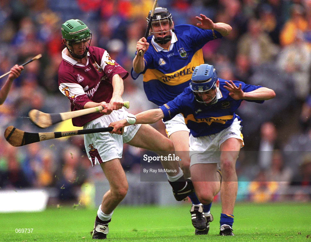 12 August 2001; Adrian Callanan of Galway shoots to score his side's goal despite the attentions of Pat Buckley of Tipperary during the All-Ireland Minor Hurling Championship Semi-Final match between Galway and Tipperary at Croke Park in Dublin. Photo by Ray McManus/Sportsfile
