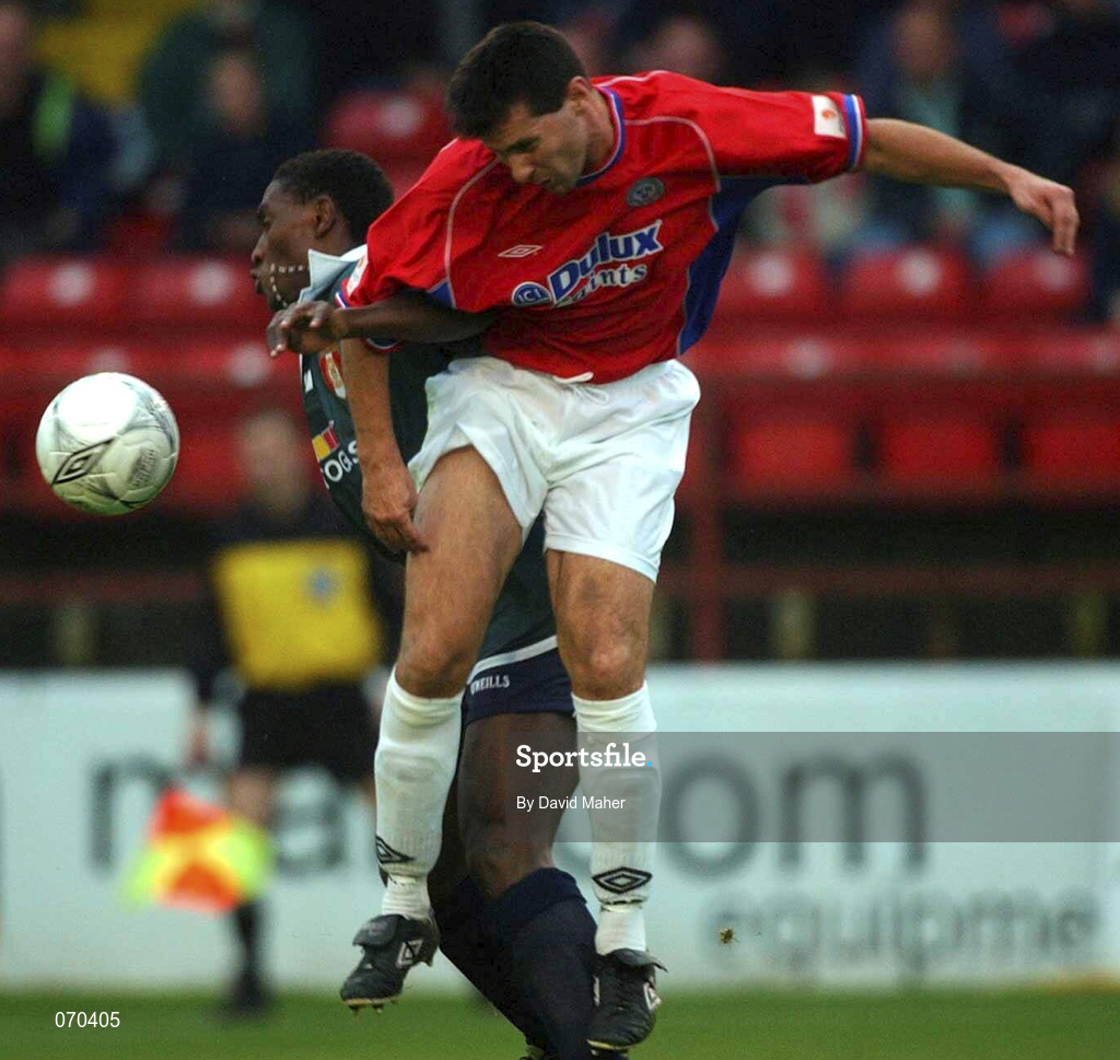 17 August 2001; Brian Byrne of Shelbourne in action against Charles Livingstone Mbabazi of St Patrick's Athletic  during the eircom League Premier Division match between Shelbourne and St Patrick's Athletic at Tolka Park in Dublin. Photo by David Maher/Sportsfile