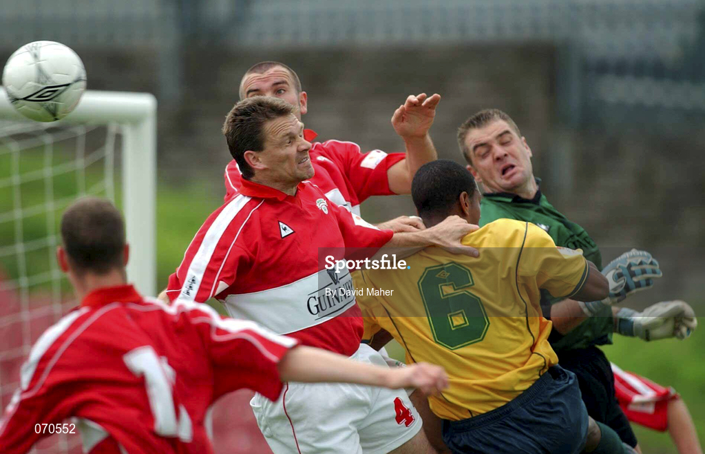 19 August 2001; Cork City players, from left, Ollie Cahill, Declan Daly, Derek Coughlan and goalkeeper Michael Devine in action against Avery John of Bohemians during the eircom League Premier Division match between Cork City and Bohemians at Turner's Cross in Cork. Photo by David Maher/Sportsfile