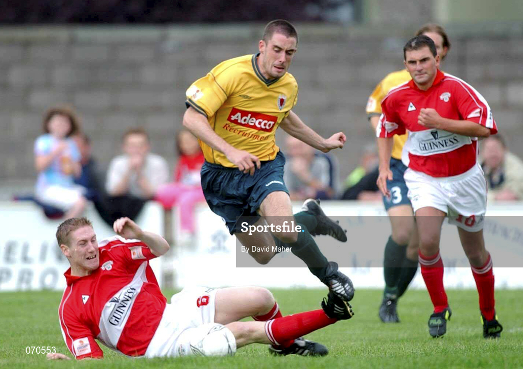 19 August 2001; Fergal Harkin of Bohemians jumps over the tackle from Conor O'Grady of Cork City during the eircom League Premier Division match between Cork City and Bohemians at Turner's Cross in Cork. Photo by David Maher/Sportsfile