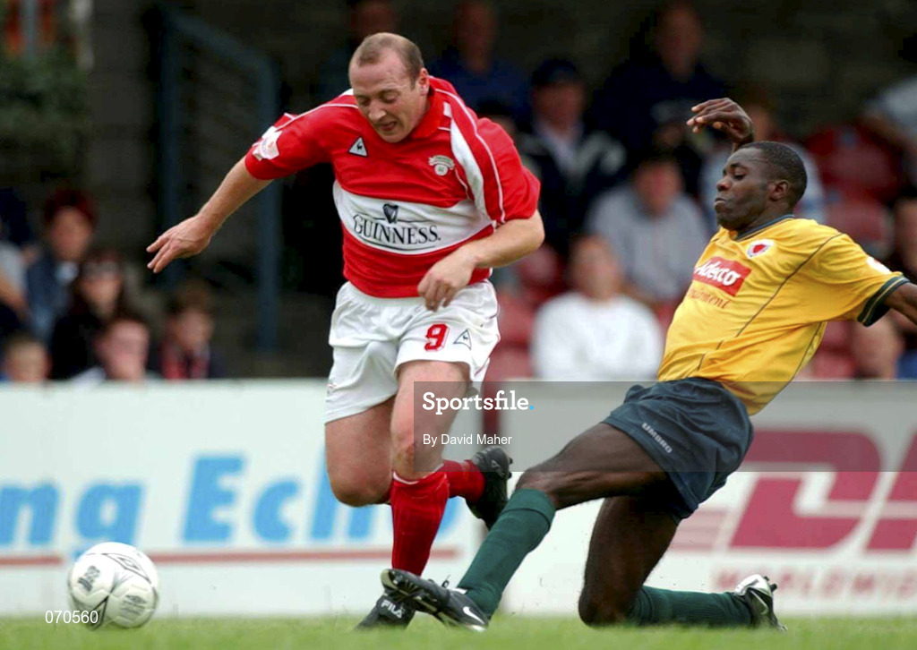 19 August 2001; James Mulligan of Cork City is tackled by Mark Rutherford of Bohemians during the eircom League Premier Division match between Cork City and Bohemians at Turner's Cross in Cork. Photo by David Maher/Sportsfile
