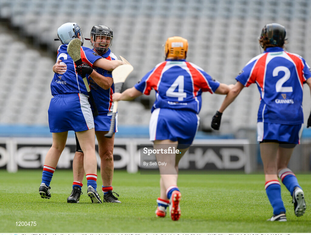12 August 2016; Barb Ruane, left, and Irene Lewis, second left, celebrate their side's victory in the GAA World Games Camogie Cup (Native) during Day 4 of the Etihad Airways GAA World Games 2016 at Croke Park in Dublin. Photo by Seb Daly/Sportsfile