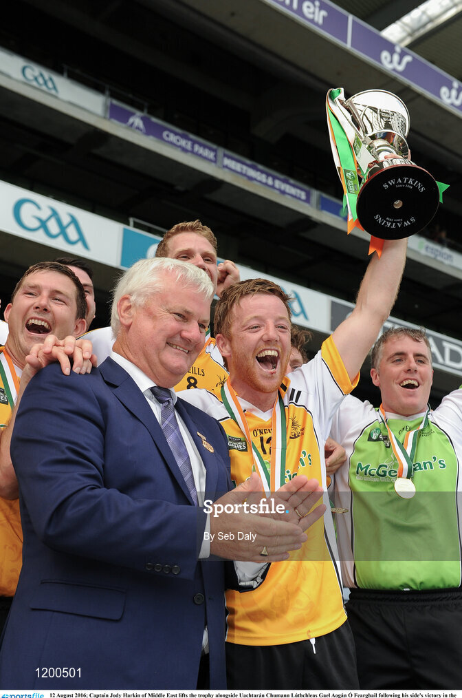 12 August 2016; Captain Jody Harkin of Middle East lifts the trophy alongside Uachtarán Chumann Lúthchleas Gael Aogán Ó Fearghail following his side's victory in the GAA World Games Huring Cup (Irish) Final during Day 4 of the Etihad Airways GAA World Games 2016 at Croke Park in Dublin. Photo by Seb Daly/Sportsfile