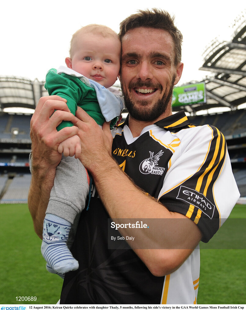 12 August 2016; Keiran Quirke celebrates with daughter Thady, 5 months, following his side's victory in the GAA World Games Mens Football Irish Cup Final during Day 4 of the Etihad Airways GAA World Games 2016 at Croke Park in Dublin. Photo by Seb Daly/Sportsfile