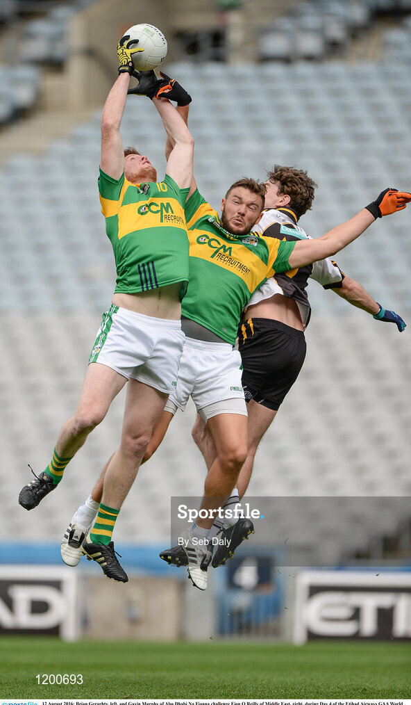 12 August 2016; Brian Geraghty, left, and Gavin Murphy of Abu Dhabi Na Fianna challenge Eion O Reilly of Middle East, right, during Day 4 of the Etihad Airways GAA World Games 2016 at Croke Park in Dublin. Photo by Seb Daly/Sportsfile