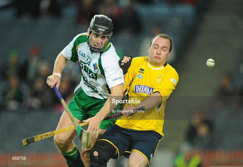 30 October 2010; Shane Dooley, Ireland, in action against Stuart Mackintosh, Scotland. Senior Hurling / Shinty International 1st Test, Ireland v Scotland, Croke Park, Dublin. Picture credit:  Stephen McCarthy / SPORTSFILE