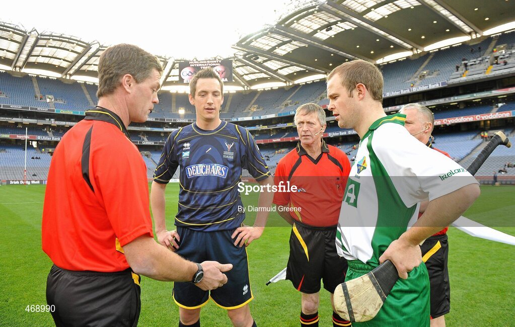 30 October 2010; Referee Tony Carroll tosses the coin between Scotland captain Gary Innes and Ireland captain Tommy Walsh before the game. Senior Hurling / Shinty International 1st Test, Ireland v Scotland, Croke Park, Dublin. Picture credit: Diarmuid Greene / SPORTSFILE