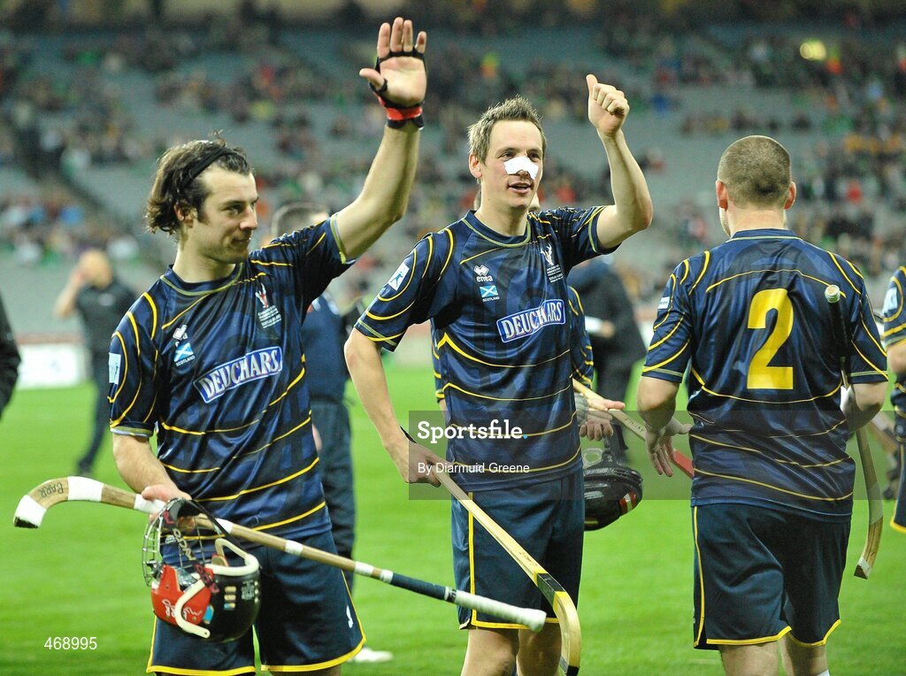 30 October 2010; Scotland's John Barr, left, and captain Gary Innes acknowledge supporters after victory over Ireland. Senior Hurling / Shinty International 1st Test, Ireland v Scotland, Croke Park, Dublin. Picture credit: Diarmuid Greene / SPORTSFILE