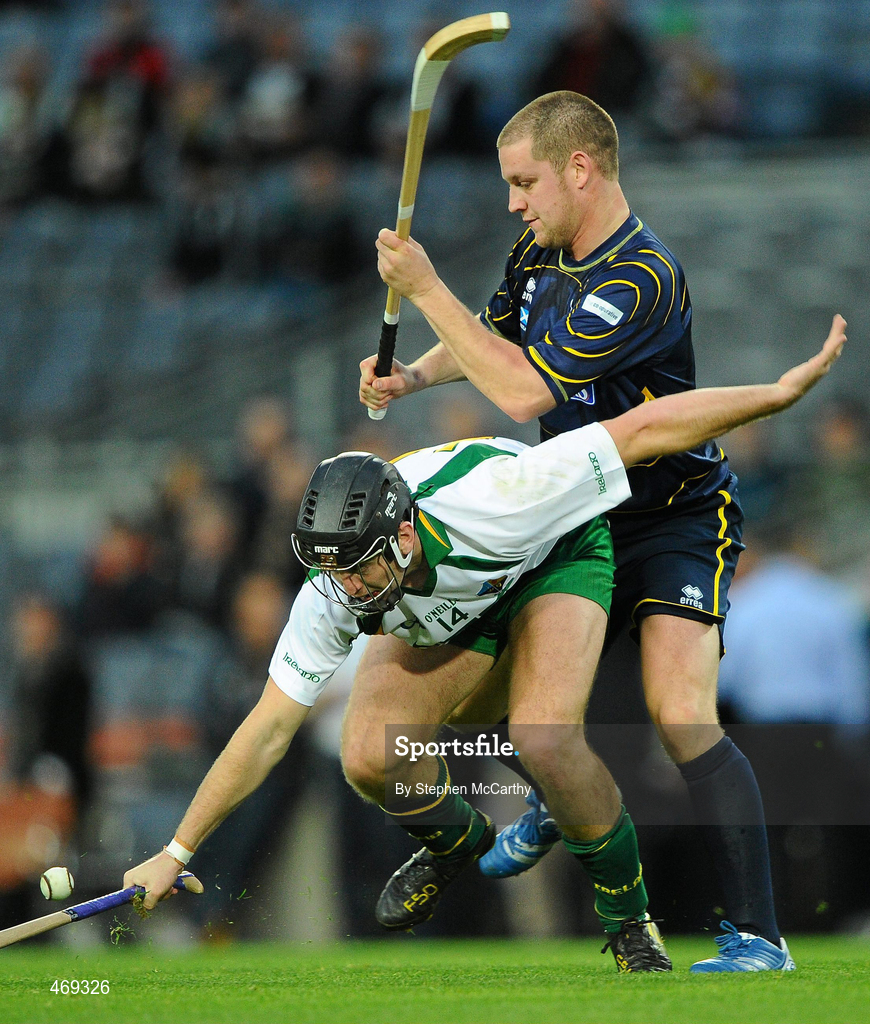 30 October 2010; Shane Dooley, Ireland, in action against Norman Campbell, Scotland. Senior Hurling / Shinty International 1st Test, Ireland v Scotland, Croke Park, Dublin. Picture credit:  Stephen McCarthy / SPORTSFILE